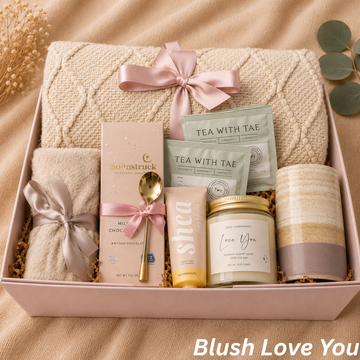 Cozy self-care gift box for women with knit blanket, socks, candle, mug and tea